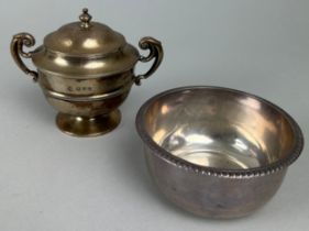 A SMALL SILVER CAMPAGNA URN SHAPED SUGAR POT WITH RISING LID AND TWO HANDLES, along with a silver