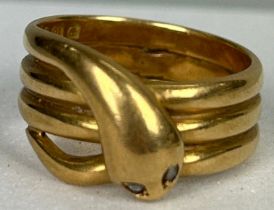 AN 18CT GOLD RING IN THE FORM OF A SNAKE WITH TWO SMALL DIAMONDS FOR EYES, Weight: 10.8gms