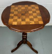 A VICTORIAN OCCASIONAL CHESS TABLE ON TRIPOD SUPPORTS