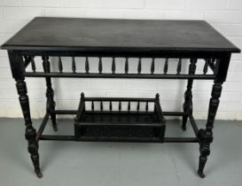 AN AESTHETIC PERIOD EBONISED VICTORIAN SIDE TABLE, Raised on four legs and castors.