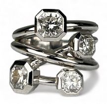 A PLATINUM RING SET WITH FOUR CORNER SQUARE 'LUCIDA' DIAMONDS, The diamonds purchased from Tiffany