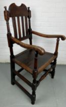 A LATE 17TH OR EARLY 18TH CENTURY SCOTTISH HALL CHAIR, Elm wood, the pierced back and wide seat