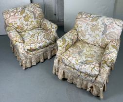 A PAIR OF DEEP SEATED COUNTRY HOUSE STYLE ARMCHAIRS, Covered in fabric printed with exotic birds,