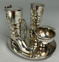A SILVER PLATED EQUESTRIAN THEMED CRUET SET, With riding boots, jockey cap and stirrups.