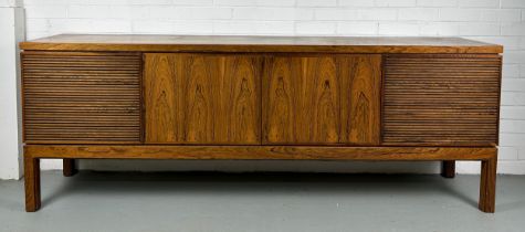 A LARGE MID CENTURY DESIGN SIDEBOARD PROBABLY CIRCA 1960's, With four swing doors, fitted interior