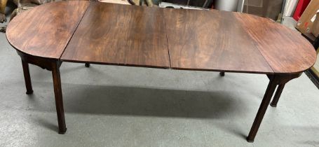 A GEORGIAN MAHOGANY DINING TABLE WITH TWO LEAFS, D end, chamfered legs.