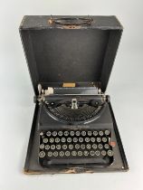 A REMINGTON PORTABLE MODEL TYPEWRITER, In a case.