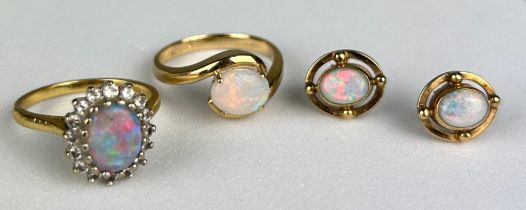 A 9CT ENGAGEMENT STYLE GOLD RING INSET WITH AN OPAL in a diamond claw setting, with a pair of
