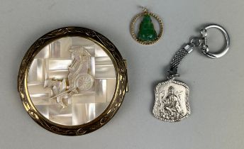 A CHINESE GOLD BROOCH WITH A CENTRAL JADE SEATED BUDDHA. Together with a Chinese silver tag chain,