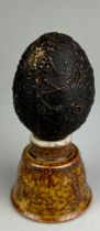 A MUSTIKA STONE EGG SHAPED FROM BANTEN WEST JAVA, Possibly 19th century. Purported to have