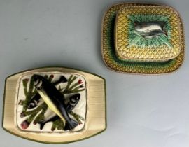 A PAIR OF MAJOLICA POTS AND COVERS DECORATED WITH FISH, the larger measuring 23.5cm w and the