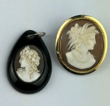 A CARVED SHELL CAMEO DEPICTING A LADY, mounted in 15ct gold oval border. Weight 10gms. Along with