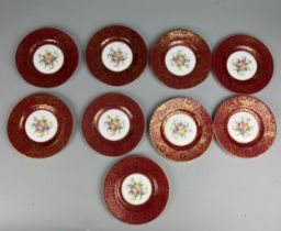 A SET OF NINE MINTON PLATES DECORATED WITH FLORAL SPRAYS,