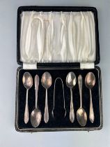 A SET OF STERLING SILVER SPOONS AND TONGS (7) Housed in antique case. Weight 80gms