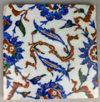 A SQUARE IZNIK GLAZED TILE PAINTED WITH FLOWERS, 25.5 x 25.5cm