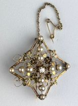 A VICTORIAN FOUR-SIDED DIAMOND SHAPED BROOCH ON 14CT GOLD CHAIN SET WITH SEED PEARLS AND A CENTRAL
