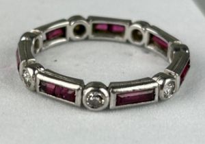 A DIAMOND PLATINUM AND RUBY RING