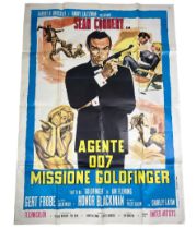 A JAMES BOND GOLDFINGER 'AGENTE 007' FILM POSTER 135cm x 100cm Folded but overall good condition.