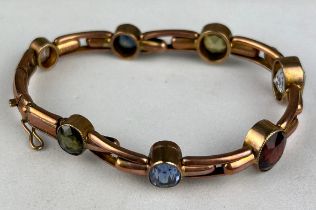A 9CT GOLD BRITTANIC BRACELET, Weight: 14.4gms, set with semi precious stones.
