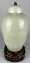 A CHINESE REPUBLIC PERIOD CELADON VASE EARLY 20TH CENTURY, Drilled as a lamp on antique rosewood
