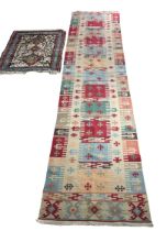 A LONG KILIM RUNNER AND ANOTHER SMALL RUG (2) Runner 310cm x 75cm.