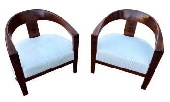 IN THE MANNER OF DAVID LINLEY: TWO DEEP SEATED MID CENTURY ARMCHAIRS WITH WHITE UPHOLSTERED SEATS (
