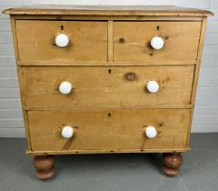 A PINE CHEST OF DRAWERS, TWO SHORT DRAWERS OVER TWO LONG DRAWERS, RAISED ON FOUR TURNED LEGS, 85cm w