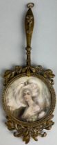 A FRENCH LATE 19TH CENTURY GILDED BRASS HAND MIRROR WITH A PORTRAIT MINIATURE OF A LADY SIGNED 'S.