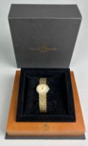 A LADIES BAUME AND MERCIER WATCH 18CT GOLD WITH DIAMOND DIAL AND BEZEL, In original box. Weight: