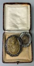 A CARVED CAMEO BROOCH DEPICTING A LADY ALONG WITH A 19TH CENTURY MOURNING BROOCH, Both housed in