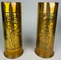 A PAIR OF BRASS TRENCH ART WORLD WAR I VASES CRAFTED FROM SHELLS, Each with hammered decoration of