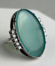 AN OVAL CABOCHON CUT NATURAL CHRYSOCOLLA-IN-CHALCEDONY FROM THE INSPIRATION MINE AND TEN (10)