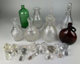 AN ASSORTMENT OF EIGHT VARIOUS CRYSTAL AND GLASS DECANTERS AND JUGS, to include various stoppers,