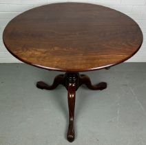 A 19TH CENTURY TILT TOP TABLE ON TURNED COLUMN AND THREE LEGS