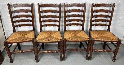 A SET OF FOUR 19TH CENTURY COUNTRY HOUSE LADDERBACK CHAIRS WITH RUSH SEATS (4) Each 100cm x 48cm x
