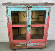 A BLUE AND RED PAINTED TEAK INDIAN CUPBOARD