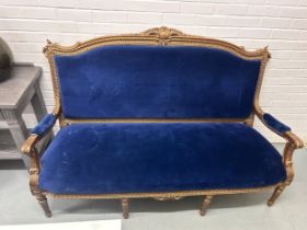 A FRENCH GILTWOOD CANAPE UPHOLSTERED IN BLUE VELVET FABRIC