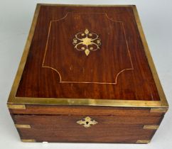 A COLONIAL INDIAN TEAK AND BRASS BOUND TRAVEL BOX, Opening to reveal a fitted interior.