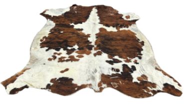 A LARGE COW HIDE RUG, 210cm x 200cm