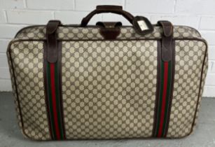 GUCCI LUGGAGE: A VINTAGE GUCCI SUITCASE, Gucci monogram throughout with brown stitched leather