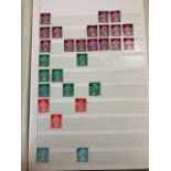 A stock album of Queen Elizabeth II definitive stamps