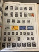 An album of Mid Century world stamps