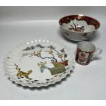 A Limoges plate along side a cup and bowl