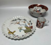 A Limoges plate along side a cup and bowl