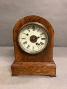 An oak case eight day mantle clock by Fehrenbach Bros