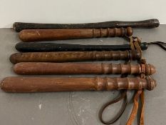 Six vintage truncheons or batons, one rubber possibly prop