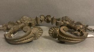Two pairs of gilt bronze curtain tie backs in the rococo style