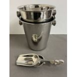 A pair of metal win/ice buckets with scoops