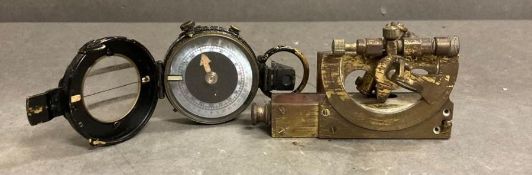 A miniature vintage sexton and a vintage compass