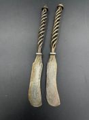 Two Mexican silver, 925, butter knives with twisted handle design.